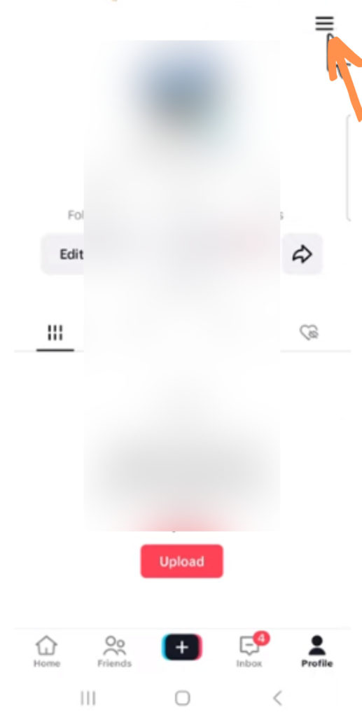 TikTok profile page pointing the menu icon