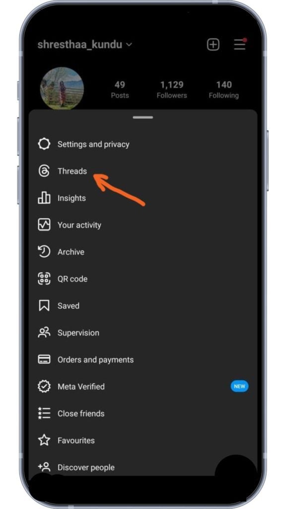 Ponting to the "Threads" option in Instagram profile menu