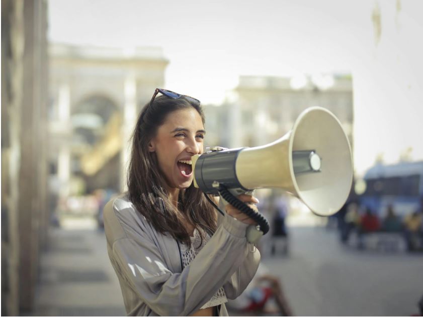 Person holding a megaphone