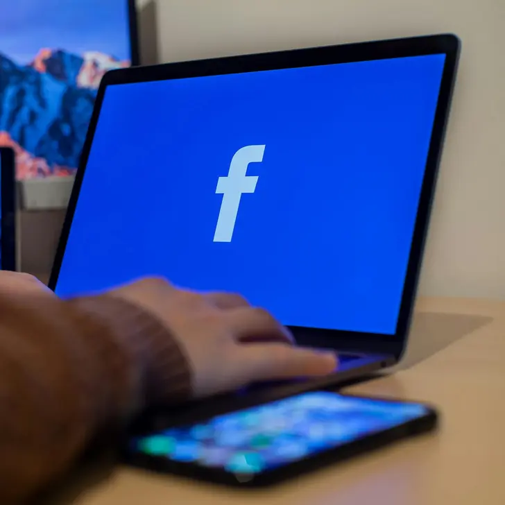 Facebook logo on desktop computer